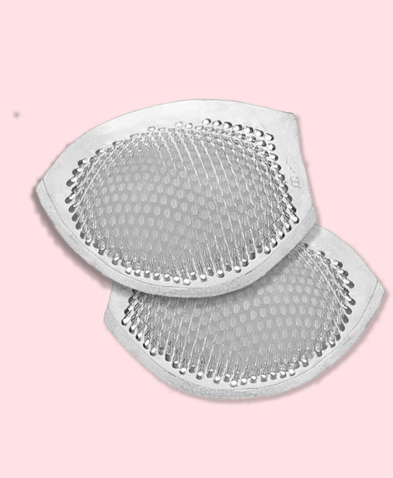 Two Breathable silicone enhancers on a pink background
